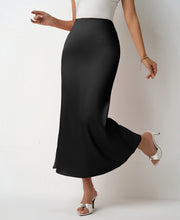 Load image into Gallery viewer, Black Chic satin midi skirt outfit for women with high waist bias cut fit. Lightweight slip skirt perfect for workwear looks, brunch styling, wedding guest outfits & TikTok viral satin skirt trends.