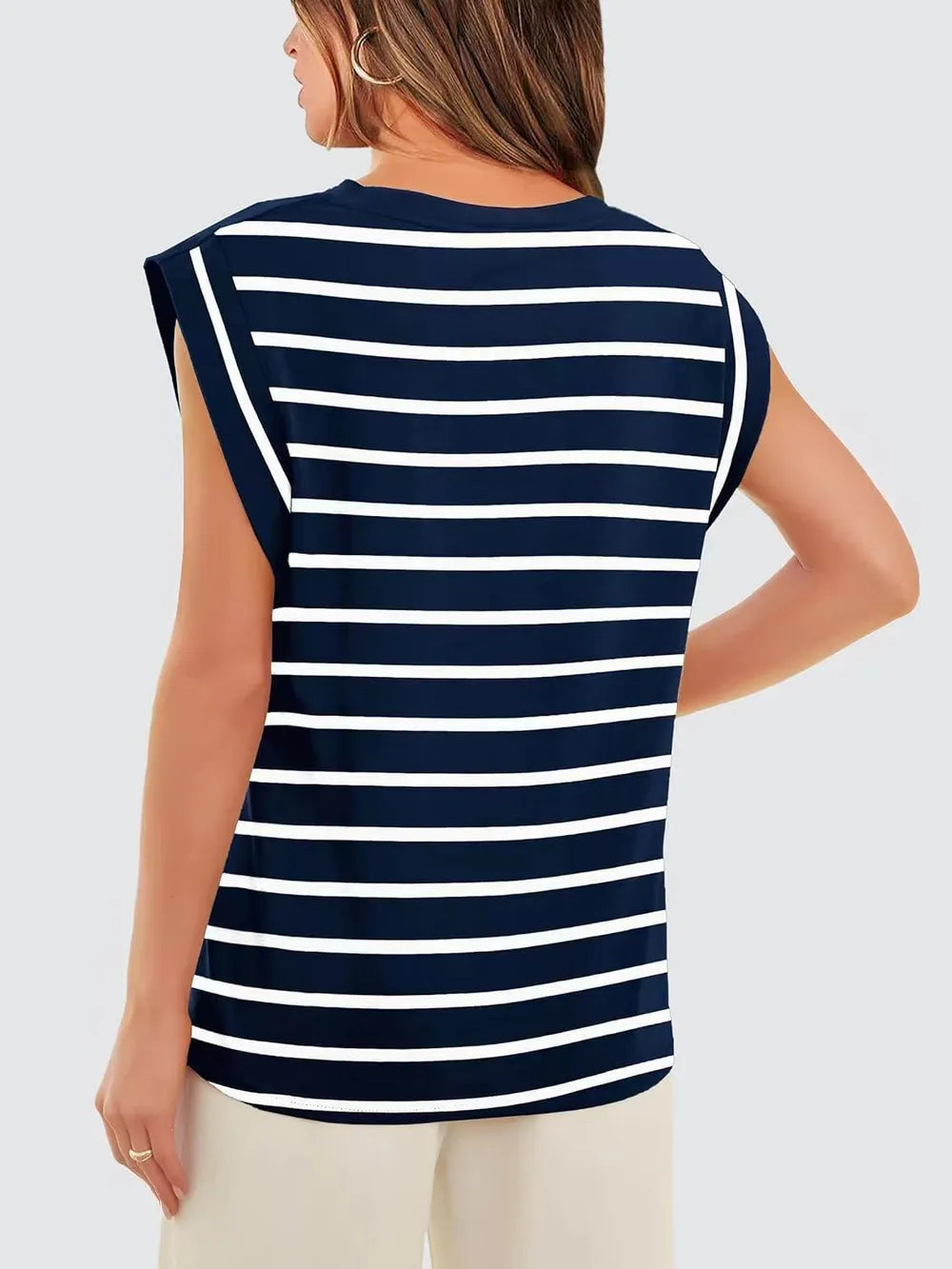 Coastal chic striped top for women in airy lightweight fabric with a flattering relaxed fit, minimalist French style summer outfit top for effortless vacation dressing.
