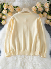 Load image into Gallery viewer, Cream textured knit cardigan with pearl buttons – relaxed fit sweater top for women, wearable for brunch outfits, work layering, and stylish fall knitwear looks.