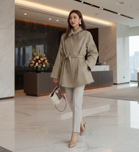 Load image into Gallery viewer, Short trench coat women in beige, perfect for brunch outfits, Instagram-worthy cropped trench coat petite women for fall layering,, business casual trench coat, fall trench coat outfit women, belted trench coat women.