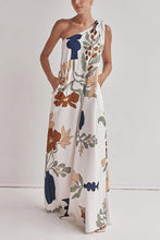 Load image into Gallery viewer, floral maxi dress, one shoulder maxi dress, boho maxi dress, Earthy print one-shoulder beach dress, Casual flowy summer dress for vacation, long white dress, Floral printed vacation dress with pockets, Chic resort wear.