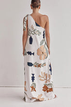 Load image into Gallery viewer, floral maxi dress, one shoulder maxi dress, boho maxi dress, Earthy print one-shoulder beach dress, Casual flowy summer dress for vacation, long white dress, Floral printed vacation dress with pockets, Chic resort wear.