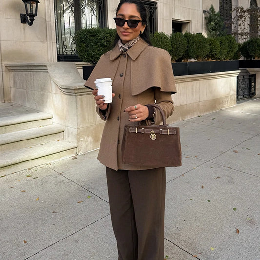 cape blazer jacket women, structured jacket women, Tailored cape jacket women with structured fit, single breasted jacket design and cape overlay, ideal business casual jacket for office wear, quiet luxury jacket style, hip length tailored jacket women.