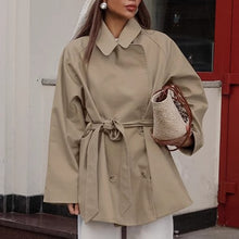 Load image into Gallery viewer, Cropped trench coat women, petite-friendly cropped trench coat, affordable short trench coat under $100 for modern layering, belted beige trench coat, quiet luxury beige trench.