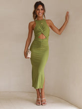 Load image into Gallery viewer, front cutout bodycon midi dress, front cutout dress, woman wearing a slim fit front cutout bodycon midi dress with side slit in sage green, sleeveless bodycon midi dress, slim fit front cutout bodycon midi dress with side slit.