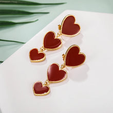 Load image into Gallery viewer, heart earrings, dangle heart shaped earrings, heart shaped clip on earrings, clip on earrings, dangle earrings, drop heart earrings, heart drop earrings, non pierced earrings, jewelry earrings, drop earrings.
