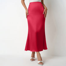 Load image into Gallery viewer, Women’s satin midi skirt with flattering drape in six colors. Elegant slip skirt styled for workwear office outfits, cocktail parties, wedding guest looks & Pinterest trending chic satin outfits.