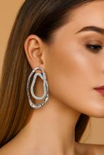 Load image into Gallery viewer, fancy jewelery, statement jewelry, Silver sculptural pavé crystal double-oval earrings, hypoallergenic and nickel-free, elegant statement drop earrings for women, U.S. jewelry fashion accessory.