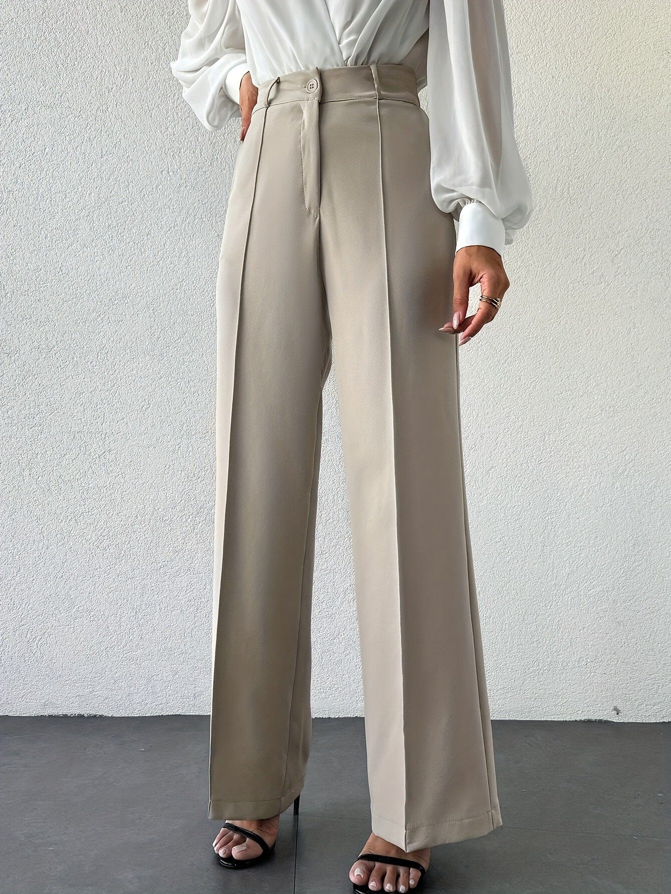 French minimalist column pants, wide-leg high waist trousers for women, versatile work to evening outfit, travel-ready neutral beige office look.