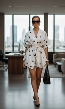 Load image into Gallery viewer, white and black polka dot outfit set, polka dot outfit, Women’s polka dot shirt shorts set featuring a belted wrap top a stylish white two piece lounge set for summer co ord outfits, island vacations, and pool party looks, brunch outfit shorts set, work-appropriate wrap kimono set women.