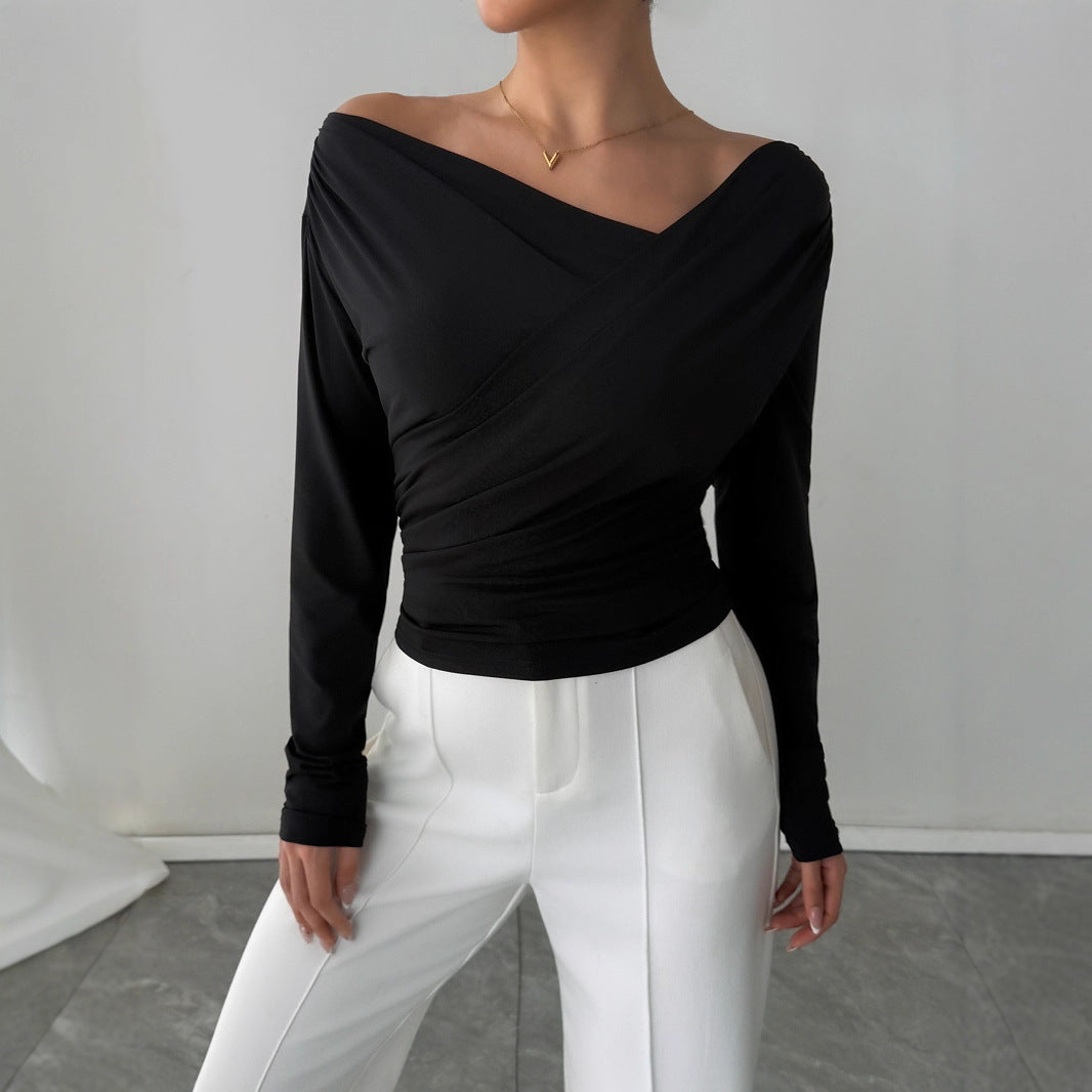 Off shoulder wrap top in black, slim fit chic blouse that works as stylish work wear top, office to evening look, Pinterest trending fall fashion blouse, and brunch ready outfit.