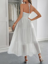Load image into Gallery viewer, Back view of flowy halterneck tiered maxi dress with ruched tiers – perfect beach dinner outfit idea.