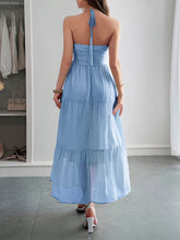 Load image into Gallery viewer, Boho Ruffle tiered maxi dress glowing in golden hour light – styled with luxury vibes for a beach resort dinner. With low back and gorgeous A line flow makes this summer maxi dress a must have. 