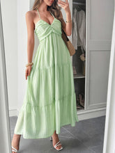 Load image into Gallery viewer, Boho Ruffle tiered maxi dress glowing in golden hour light – styled with luxury vibes for a beach resort dinner. With low back and gorgeous A line flow makes this summer maxi dress a must have. 