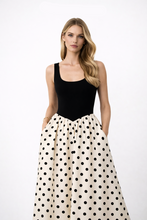Load image into Gallery viewer, Colorblock maxi dress with black bodice dress hourglass shaping and cream polka dot skirt black top contrast, polka dot occasion dress suited for spring polka dot maxi dress and summer polka dot dress.