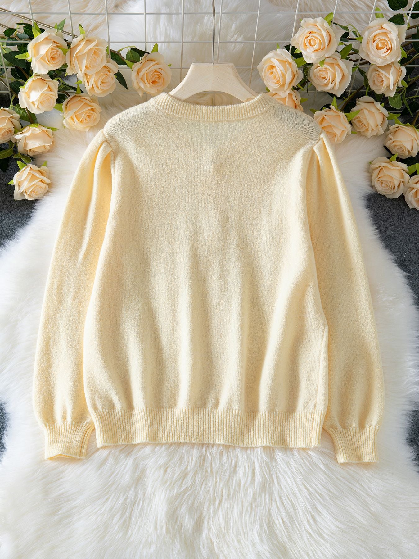 Cream textured knit cardigan with pearl buttons – relaxed fit sweater top for women, wearable for brunch outfits, work layering, and stylish fall knitwear looks.