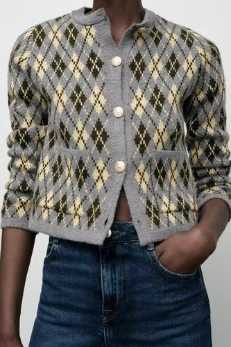 Cropped grey argyle button-up knit cardigan for women with gold buttons, preppy collegiate diamond pattern, and vintage-inspired fall layering cardigan look for office, brunch, or weekend wear.