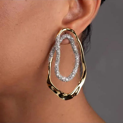 Diamond drop earrings, statement earrings, Gold sculptural double-oval statement earrings for women featuring pavé crystal accents, hypoallergenic metal, lightweight drop design, elegant modern jewelry USA.