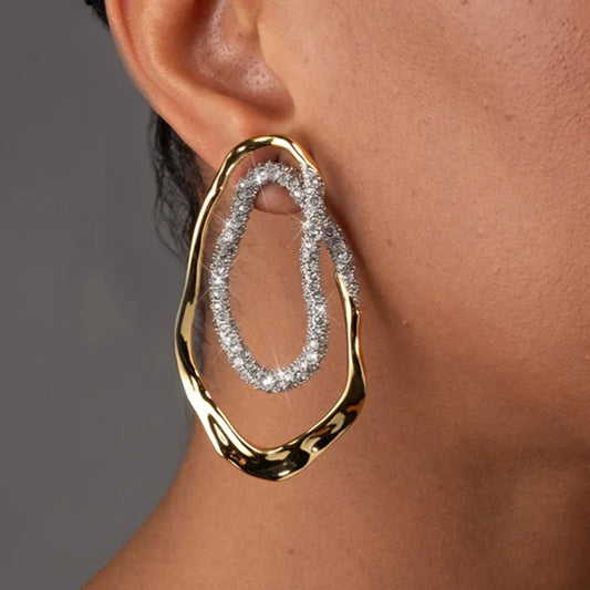 Diamond drop earrings, statement earrings, Gold sculptural double-oval statement earrings for women featuring pavé crystal accents, hypoallergenic metal, lightweight drop design, elegant modern jewelry USA.