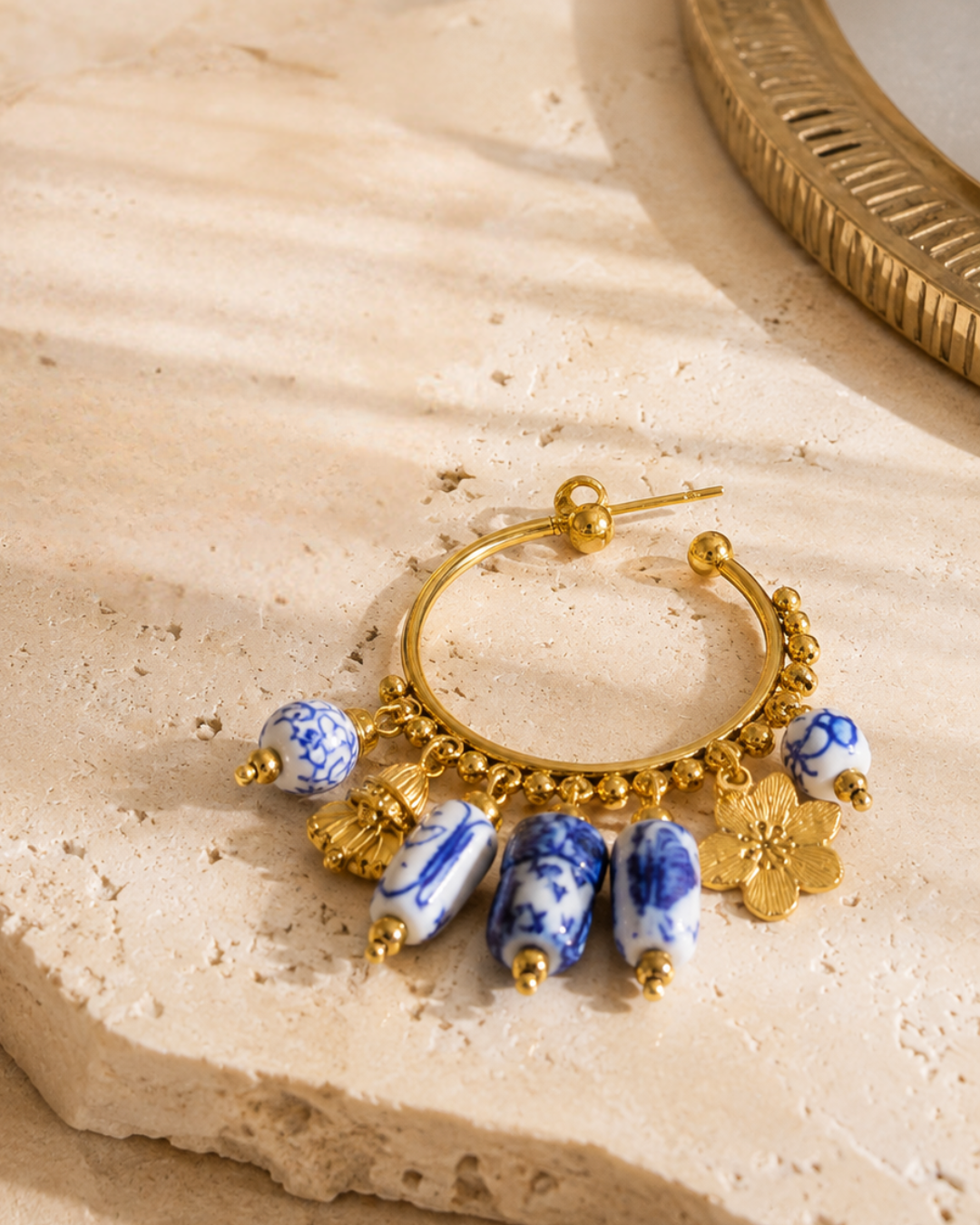 quiet luxury Gold Plated Hoop Earrings, Women's ceramic drop earrings with porcelain-inspired blue and white beads, open gold hoop construction and articulated charm details for vacation styling, wedding guest looks and chic everyday accessories.