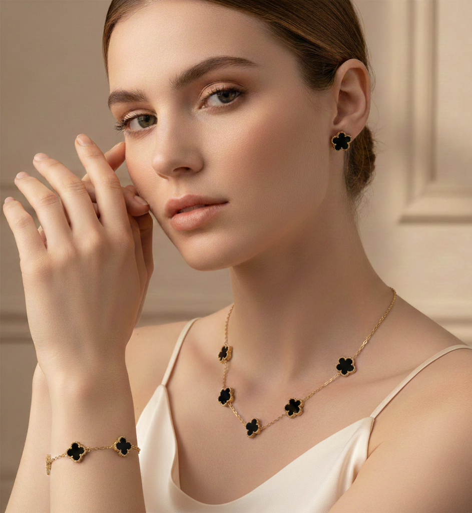 Floral jewelry set with enamel clover charms, glossy stone texture and gold necklace bracelet earrings set styling, refined minimal chain design, elegant clover jewelry set for women, date night accessory, 4 leaf clover necklace bracelet earrings set, enamel jewelry set, gold minimalist jewelry set, dainty gold jewelry set.