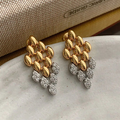 Gold geometric dangle earrings for women featuring a rhombus-shaped drop with crystal stone detailing. elegant drop earrings, chic dangle earrings for women, party earrings women, Lightweight statement earrings ideal for workwear, office outfits, party wear, weddings, and evening looks.
