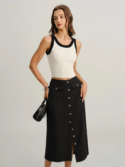 button front midi skirt, black pencil skirt midi, workwear midi skirt, High waisted black midi skirt, smooth structured texture with front button closure and flap pocket detail, body-skimming silhouette, button front midi skirt work outfit, ideal for office wear styling.