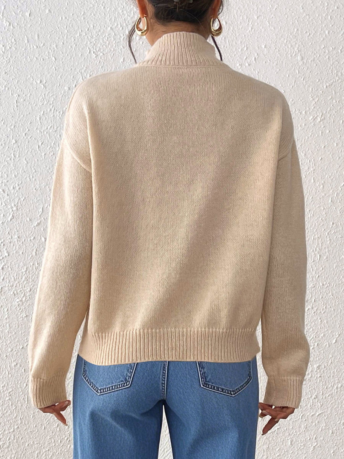 Mock neck beige knit sweater with floral daisy buttons, soft cozy fall sweater for women, Pinterest-style winter outfit aesthetic, warm wool blend top for everyday wear.