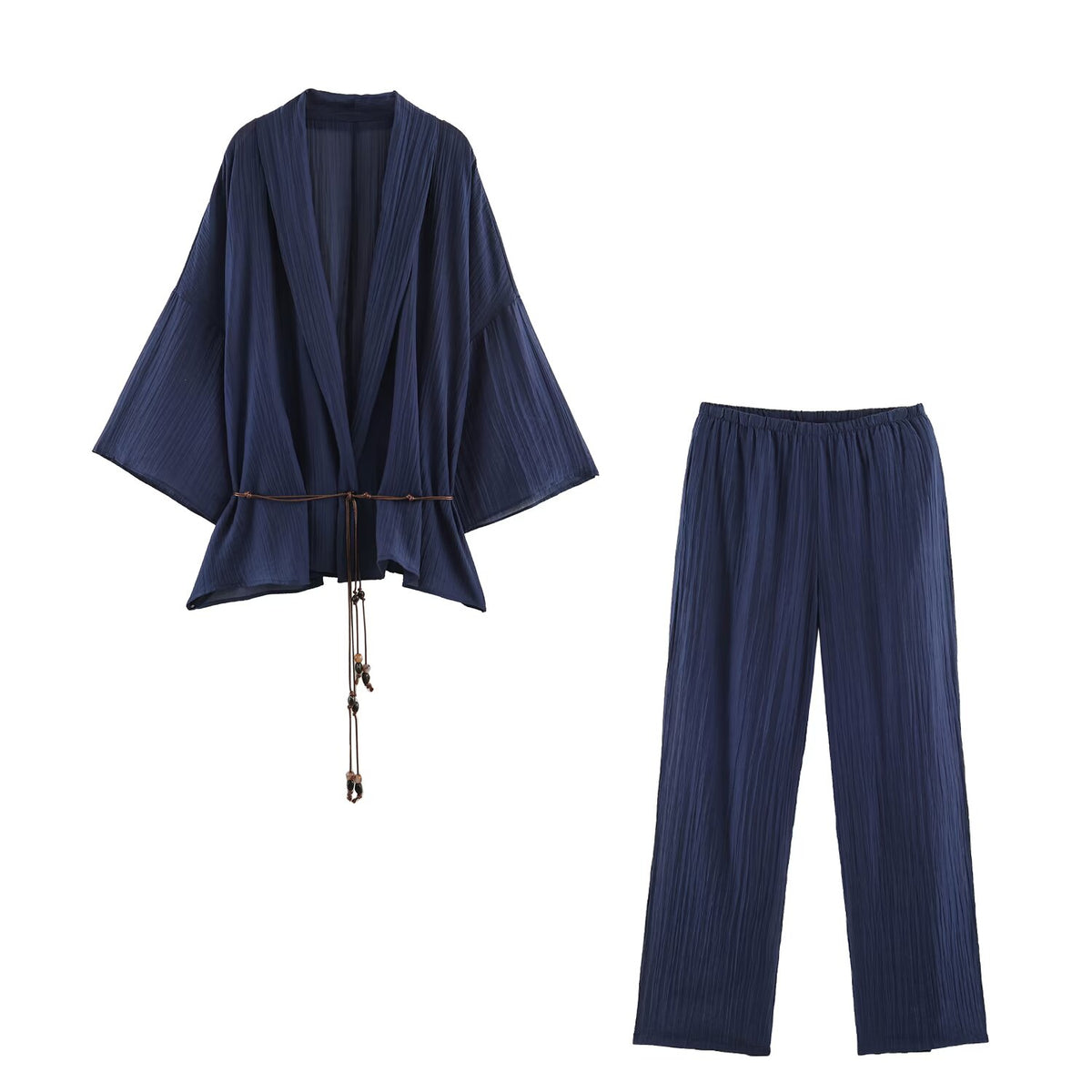 Navy two piece pants set women with a relaxed wide-leg silhouette, featuring a pleated wrap-front top and adjustable tassel waist tie, styled as a quiet luxury matching set for business casual two piece set women.
