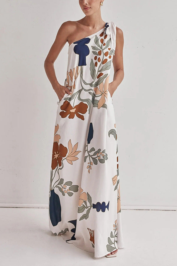 floral maxi dress, one shoulder maxi dress, boho maxi dress, Earthy print one-shoulder beach dress, Casual flowy summer dress for vacation, long white dress, Floral printed vacation dress with pockets, Chic resort wear.