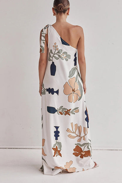 floral maxi dress, one shoulder maxi dress, boho maxi dress, Earthy print one-shoulder beach dress, Casual flowy summer dress for vacation, long white dress, Floral printed vacation dress with pockets, Chic resort wear.