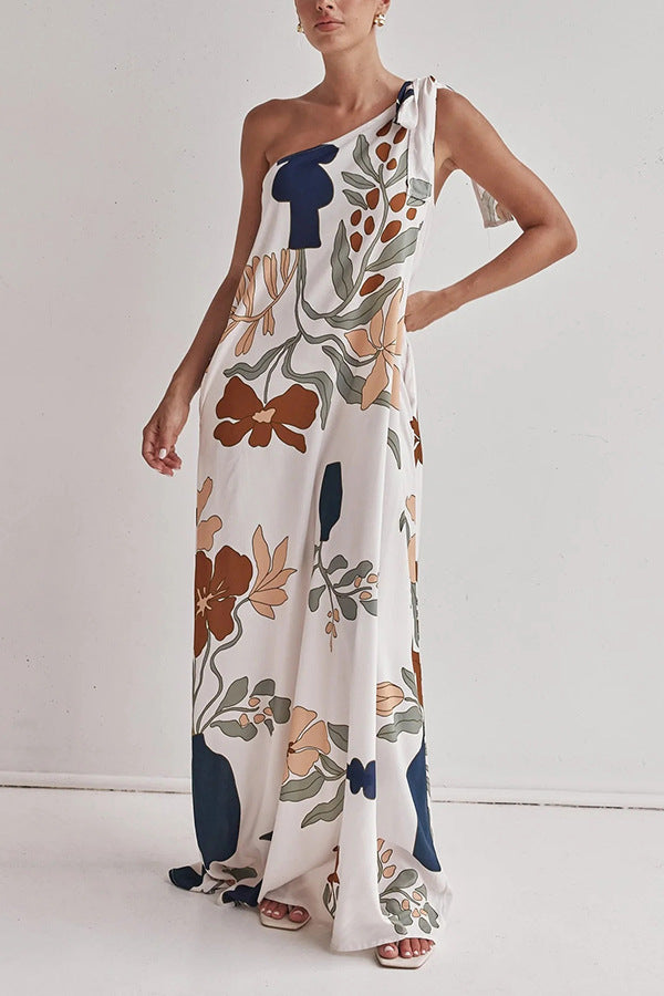 floral maxi dress, one shoulder maxi dress, boho maxi dress, flowy maxi dress, long dresses, Floral printed vacation dress with pockets,  Bohemian one-shoulder maxi dress for beach trips,  Lightweight summer dress,  Trendy one-shoulder dress, Effortless elegance dress,  Chic resort wear.