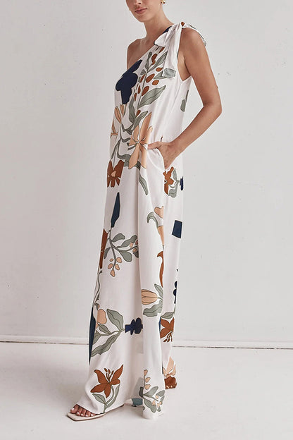 floral maxi dress, one shoulder maxi dress, boho maxi dress, flowy maxi dress, long dresses, tie shoulder maxi dress, printed summer dress, Summer vacation dress, Flowy printed dress, earthy floral dress, Vacation-ready outfit, long white dress, summer beach wear outfit 2025, Bohemian one-shoulder maxi dress for beach trips.