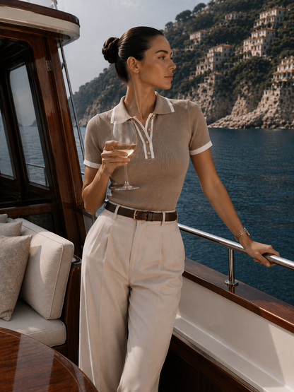 Old money taupe fitted polo shirt with fine ribbing, contrast collar and sleeve edging, a minimalist option for travel wardrobes, daytime dressing and effortless European summer style for women. contrast trim polo top styled for office wear, with its fitted ribbed knit silhouette, classic collar and button detail making it a polished choice for business casual and elevated basics