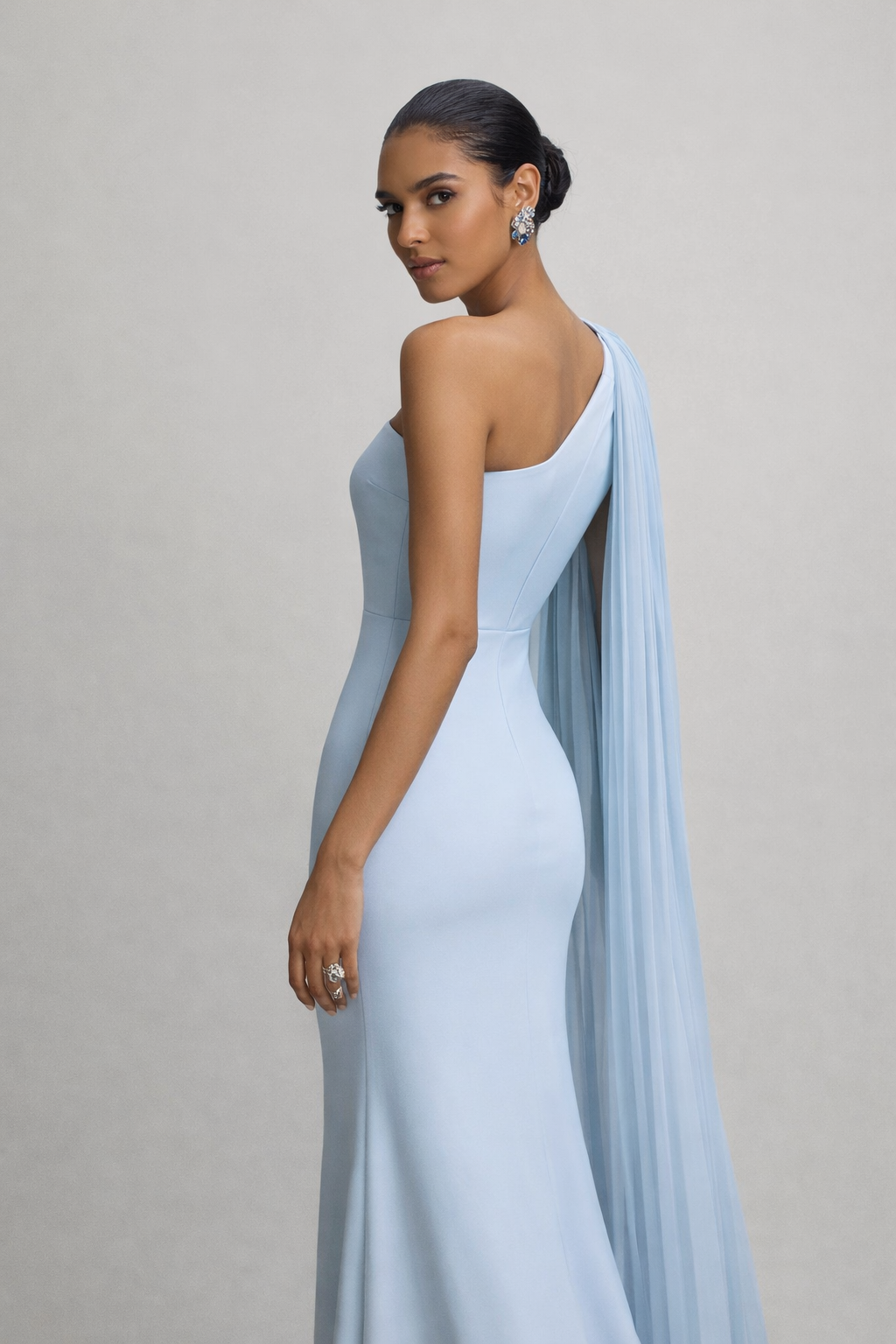 One shoulder evening gown with flowing pleated cape sleeve and bodycon silhouette, icy blue maxi gown, perfect for evening party dresses and wedding guest dresses with maxi length formal elegance and sculpted fit