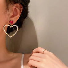 Load image into Gallery viewer, heart drop earrings, rhinestone heart earrings, Heart earrings, heart dangle earrings, dangle earrings, Quirky earrings for women, Chic earrings for women, Statement earrings, , Modern fashion earrings, Elegant jewelry for women, Fun fashion jewelry, Women’s statement earrings, Quirky jewelry, Chic women’s accessories, Fun fashion accessories, Playful earrings, Chic statement jewelry, Unique women’s earrings, Everyday chic earrings.