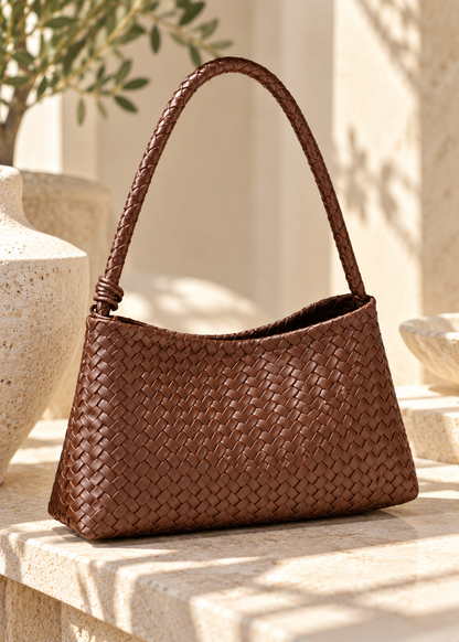 Women’s woven hobo bag in brown with a curved relaxed silhouette, tactile basket weave body, braided shoulder strap and matching zip pouch, creating a contemporary textured handbag for office dressing, weekends and everyday wear.