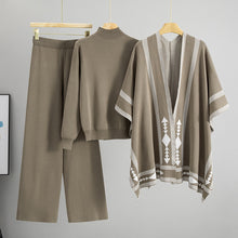 Load image into Gallery viewer, Taupe 3 piece knit lounge set for women, 3 piece knit set for women with mock neck sweater, wide-leg knit pants, and poncho chic cozy outfit for travel, dinner, or brunch, knit lounge set women, chic 3 piece outfit, 