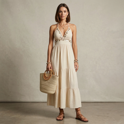 Tiered maxi dress, open back maxi dress, Beige bohemian halter maxi dress with deep V halter neckline, smocked waist maxi and flowing tiered maxi dress silhouette, lightweight tiered boho maxi ideal for beach vacation tiered maxi dress styling, beige maxi dress, vacation halter dress.