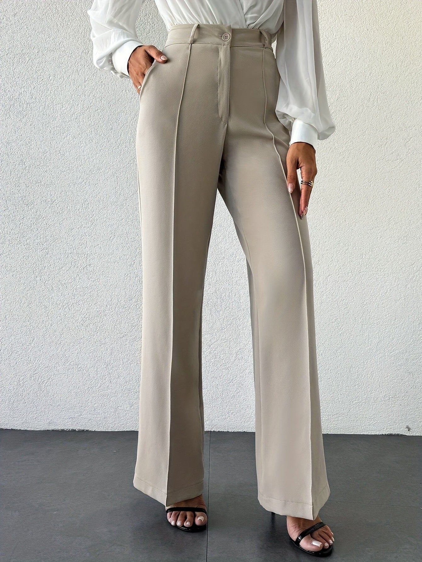 Women’s column wide-leg trousers with center crease, high waist neutral beige tailored office pants, business casual wardrobe essential.