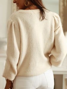 Women’s pearl-button knit cardigan sweater in cream, relaxed fit with subtle puff sleeves and ribbed hem – ideal cozy cardigan for work layering and stylish sweater top looks.