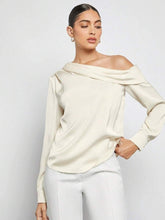 Load image into Gallery viewer, Ivory satin satin one-shoulder blouse women with refined silhouette quiet luxury cocktail blouse for women who love elevated evening wear, Women’s satin blouse one-shoulder style in ivory, long sleeve on one side and exposed shoulder on the other evening top satin women for date night.
