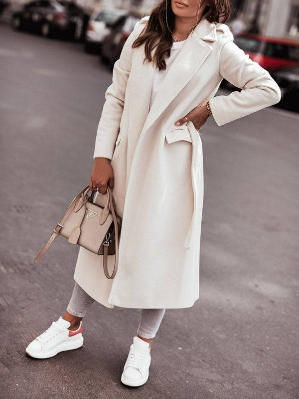 Women’s white wool blend wrap coat featuring a soft structured silhouette, tie-front closure, and mid-calf length, suitable for professional and minimalist wardrobes.