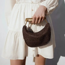 Load image into Gallery viewer, Woven bucket bag, summer straw purse with metal sculptural handle, evening soiree handbag, lightweight casual chic look.