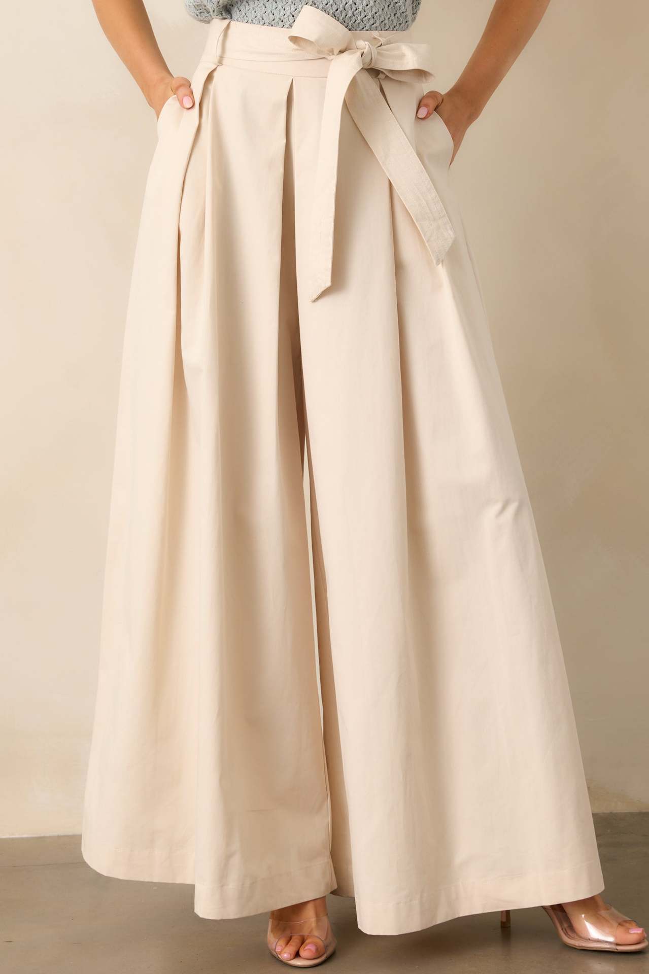 apricot belted pleated wide leg pants, cream high waisted wide leg pants, business casual pants women, workwear trousers women, neutral outfit pants women, elegant wide leg pants, high waist trousers women.