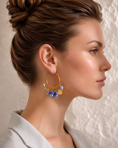 Women's ceramic drop earrings with blue and white porcelain-inspired beads, PVD real gold plating and a statement hoop silhouette, designed as elegant gold drop earrings for women looking for distinctive everyday fashion jewellery.