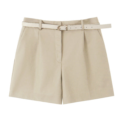 Tailored pleated wide-leg belted shorts for women in beige, high-waist poly-cotton summer shorts for office wear, travel outfit, minimalist chic brunch look, and vacation-ready neutral outfit.