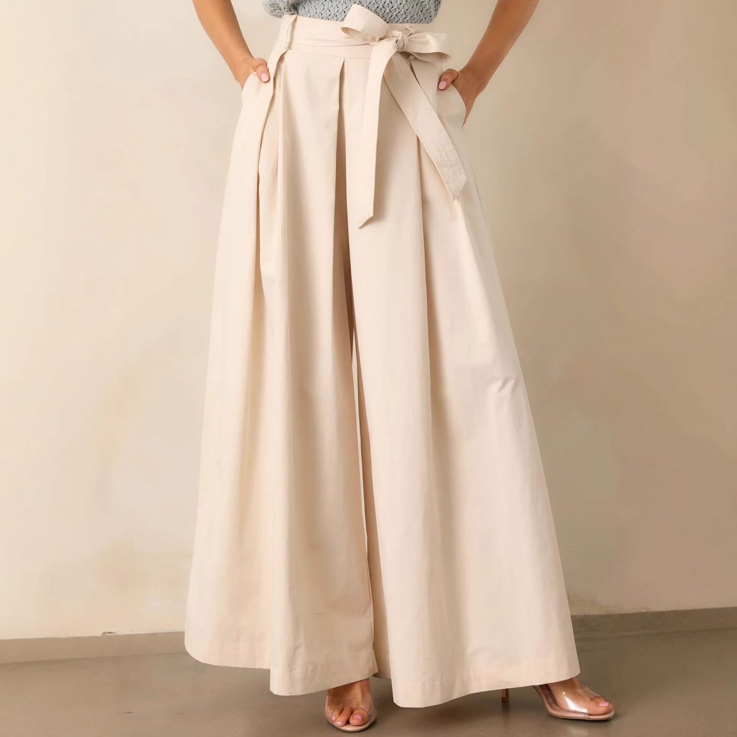 belted wide leg pants, high waisted wide leg pants, Cream wide leg pants women, smooth structured fabric with high waisted belted design, flowy full length silhouette, cream wide leg pants outfit women, perfect for business casual wear, business casual pants women.
