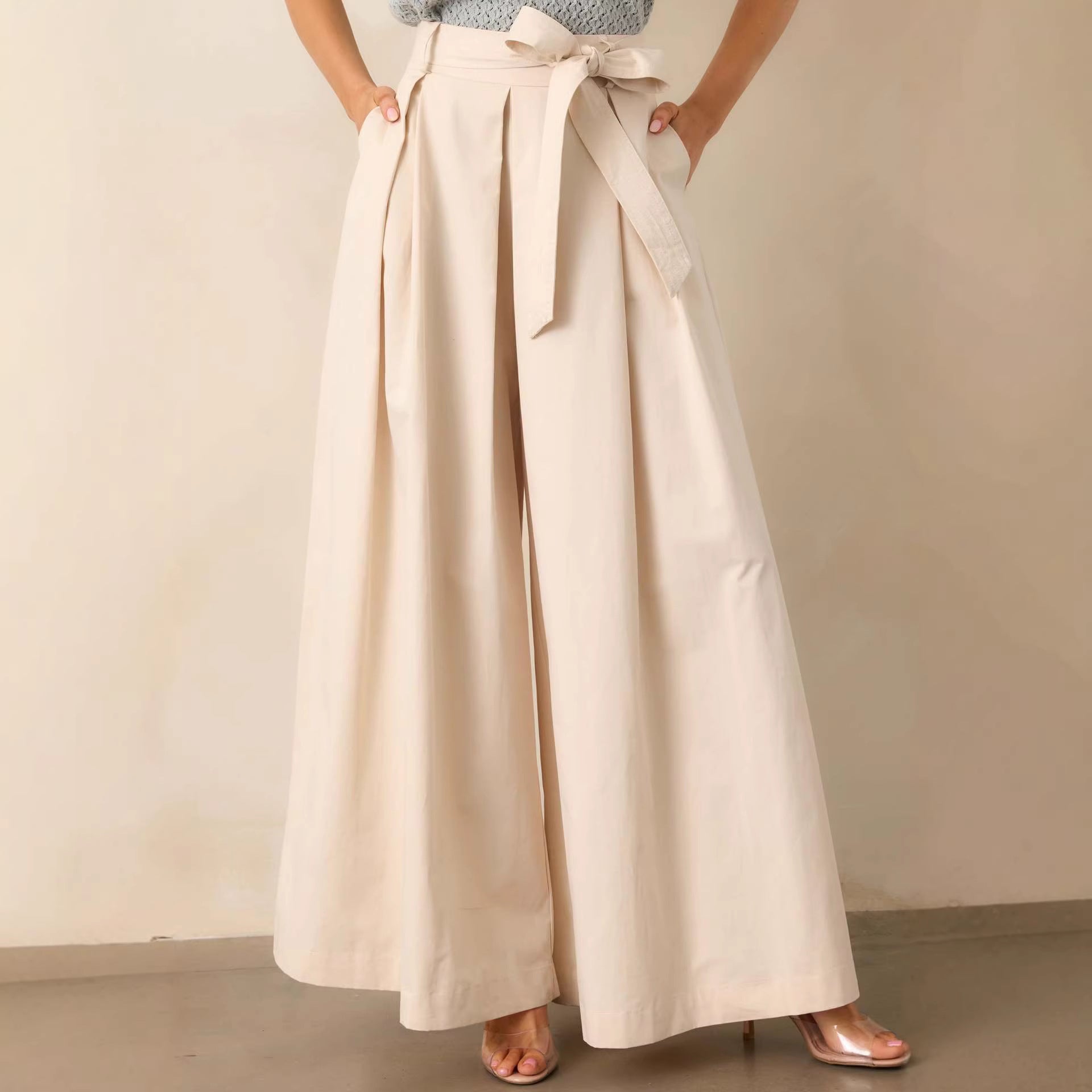 belted wide leg pants, high waisted wide leg pants, Cream wide leg pants women, smooth structured fabric with high waisted belted design, flowy full length silhouette, cream wide leg pants outfit women, perfect for business casual wear, business casual pants women.