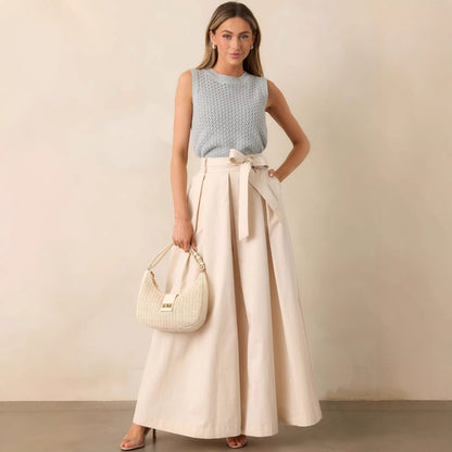 high waisted cream belted wide leg pants, high waisted wide leg pants work outfit, belted wide leg trousers women outfit, casual chic outfit women, Belted wide leg pants women, lightweight structured fabric with adjustable tie waist and side pockets, full length flowy silhouette, cream trousers outfit business casual women, perfect for work outfits.
